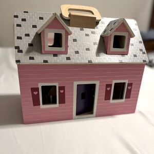 Melissa and Doug fold and go wooden doll house